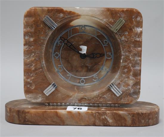An Art Deco onyx and diamond mantel clock